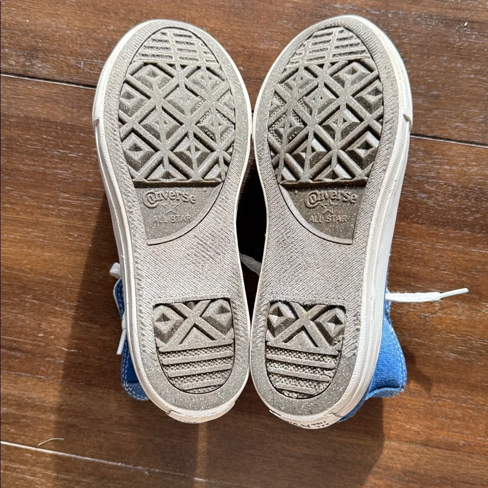 Size 2 Converse Chuck Taylor All Star Sneakers on blue